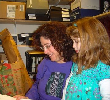 Becky Derby doing research in the archive closet.